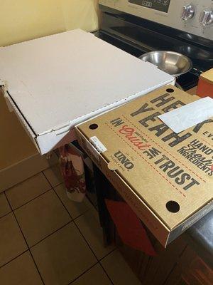 Uno's pizza box next to the large white box from Tony's Pizza on Boston Road.