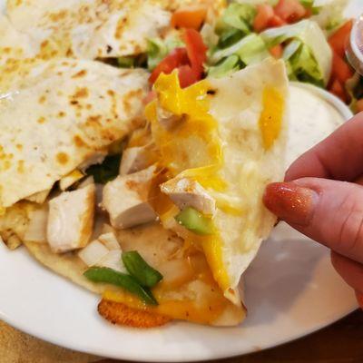 Inside of a Colorful "Hawaiian Chicken Quesadilla" with diced chicken, onions peppers, cheese, Hawaiian Salsa Sauce.  6/29/2022