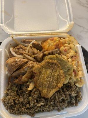 Duri Djon Djon (black mushroom rice with green peas), stew chicken, fried plantains and macaroni and cheese. Sooo good!