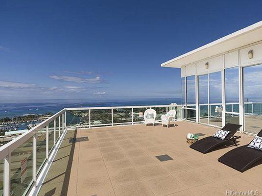 View from a penthouse unit in 909 Kapi'olani Blvd. A spectacular view of the coast!