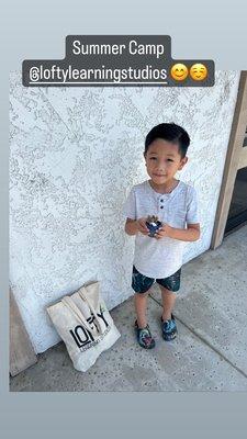 My son with the plant he planted and little plater he painted at Lofty!