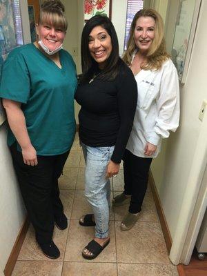 After almost a year of treatments and my now dazzling smile, here I am with my great team, Dr. Sherri Bluth and Jessica.