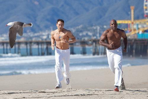 Mark Dacascos and Mestre Amen training on the beach