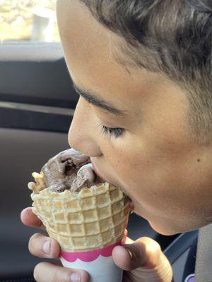 Two scoops of Rocky Road in a waffle cone