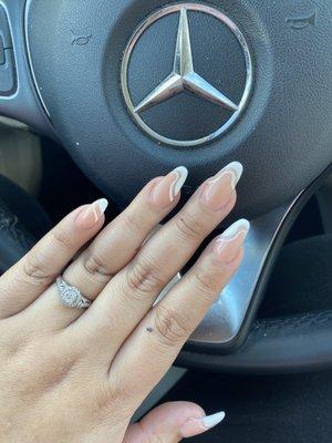 Nude almond nails with white abstract designs