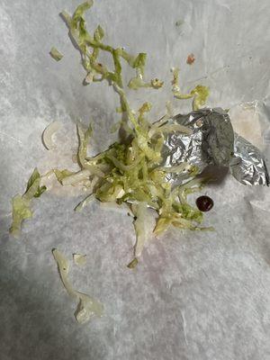 Cooked and soggy lettuce I picked off the wrap