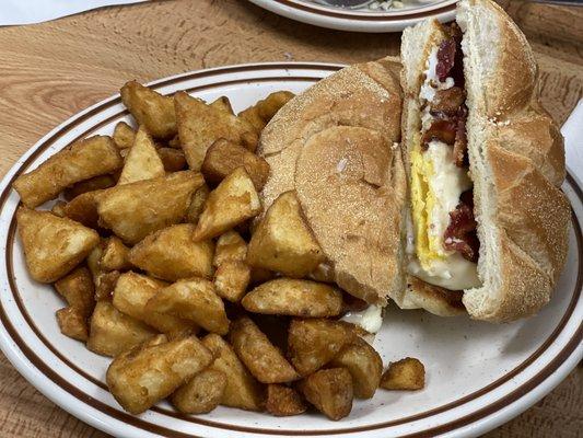 Bacon egg and cheese sandwich with home fries