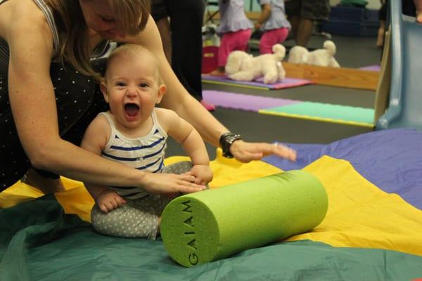 Eva enjoying parachute time in Music & Movement baby class