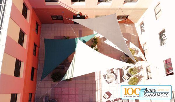 A Playful Geometry of Light: Three Triangular Shade Sails Intersect Above Evans Hall, UC Berkeley