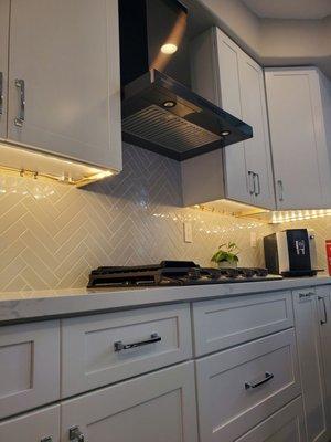 Custom backsplash Range top base with drawers Saucing cabinet Custom installed range hood