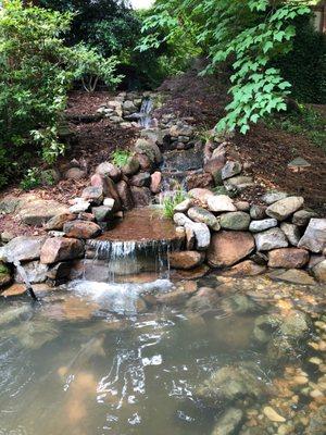 Beautiful backyard koi pond with waterfall