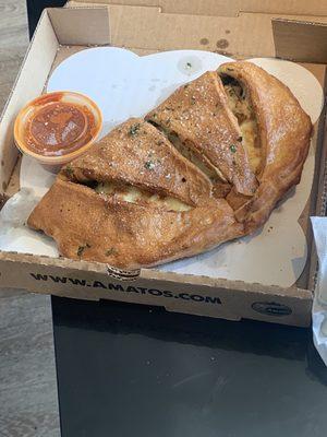 Chicken fresh spinach calzone sauce on side. $14.