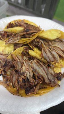 Tacos Al pastor (before I added the yummy sauces) they add a piece of pineapple and it compliments the pork taco