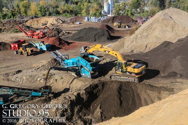 Screening topsoil requires heavy duty equipment. Our Caterpillar excavator loads or Warrior screen to sift the soil and remove debris.