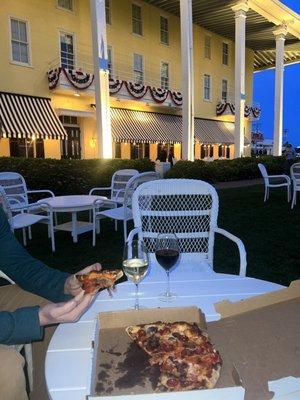 Pepperoni and mushroom pizza. A glass of Pinot Grigio and Cabernet Sauvignon from the outside bar.