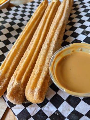 Churros. 3 for $6.50. Fried dough filled with Bavarian cream and served with dolce de leche.