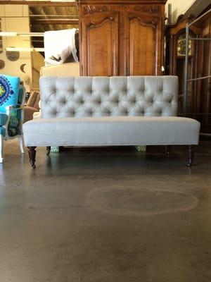 Tufted setee with turned legs on casters!