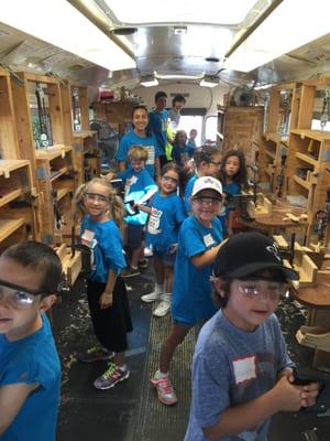 Davincheese campers having a blast on our Woodworking bus!