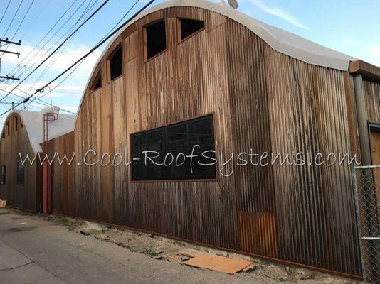 Spray foam roofing on a Quonset hut metal building in Culver City.