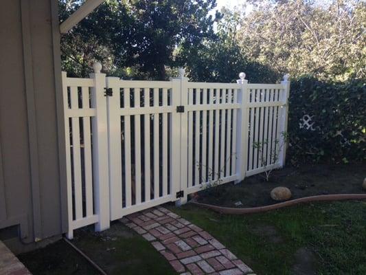 Opposite side of house from driveway - beautiful fencing and gate