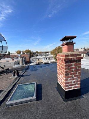 New flat roof , new skylight , new chimney