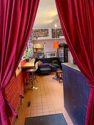 Stepping inside, cool entryway with red curtains