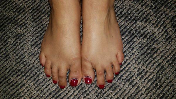 Pretty red toes with sparkling stones