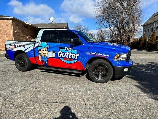 This image showcases our top-notch vehicle wrap design and installation services. The truck features a vibrant and attention-grabbing wrap f