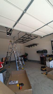 Installation of the storage system on the ceiling and on the wall in the garage