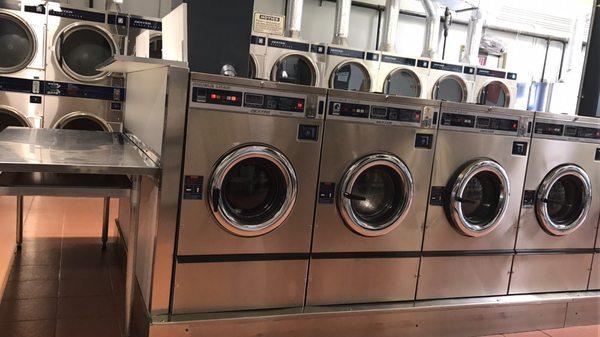 Double Load Front-Load Washers (in front) & Stack Dryers (in rear). Stainless-steel counter to fold your laundry. Super clean.