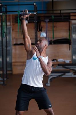 Coach G demonstrating Kettle bell work