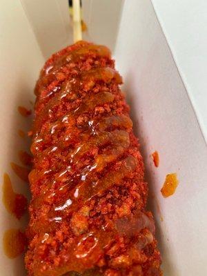 Corn dog with hot Cheeto crumbs