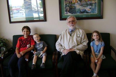 Dr. Plamenac with Some Smiling Young Patients