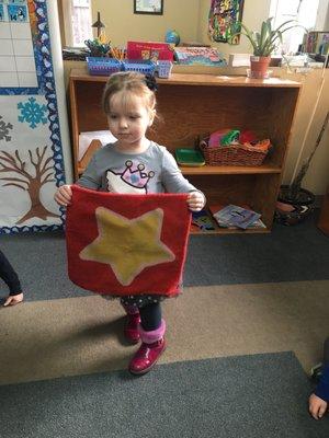 The "Star of the Day" mat! She gets to sit by the teacher, bring a healthy snack to share with the class, go first to recess & pick a friend