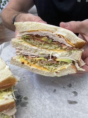 Turkey bacon avocado (large, triple decker) on sourdough bread. His favorite!