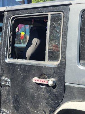 Busted windows jeep ransacked