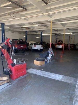 White Ford Taurus at Joe's Auto Services being repaired