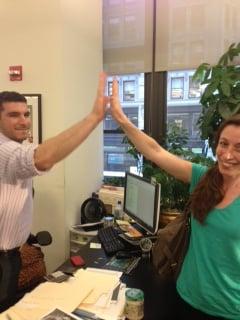 high fives after signing the paperwork to our new apartment