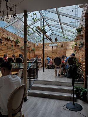 Indoor courtyard seating in the back