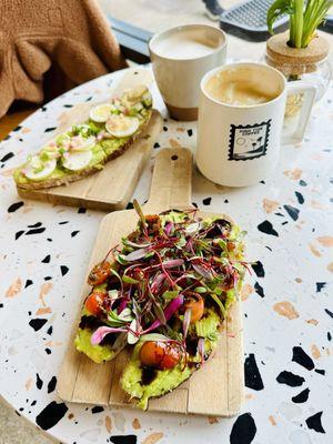 Chai latte, Cardamom latte, shaved egg and tomato & micro greens avocado toasts