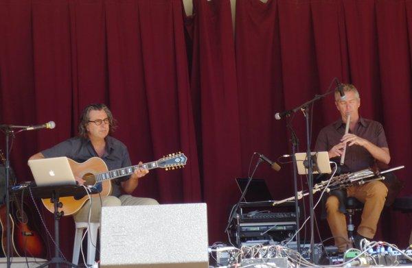 Uilleann pipes in the guy's lap on the right.