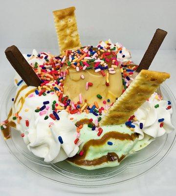 NYer's Supreme, ice cream topped w/ pudding, sauce topping, whipped cream, and toppings