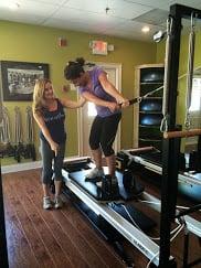 Pilates Tutor East Cobb location teaches golf fitness on the stott v2 max plus reformer