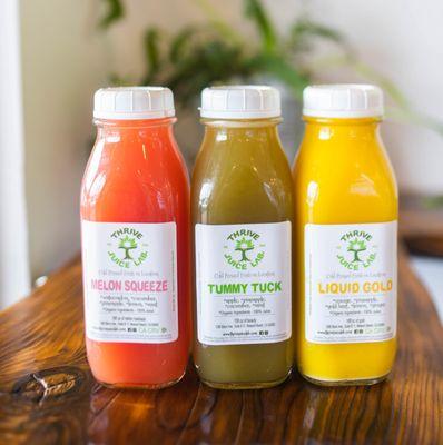 Melon Squeeze, Tummy Tuck, and Liquid Gold organic cold pressed juices.