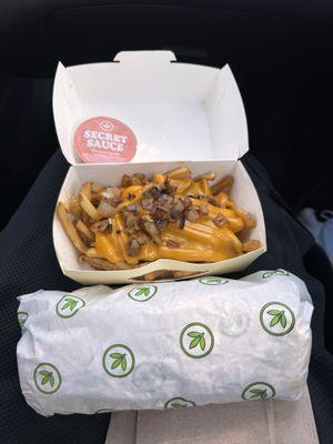 Iconic Fries (with sauce on the side) and a buffalo 'chicken' caesar wrap