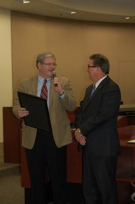 Mayor David Sander presents outgoing Councilman Ken Cooley with a proclamation honoring his service to Rancho Cordova since 2002