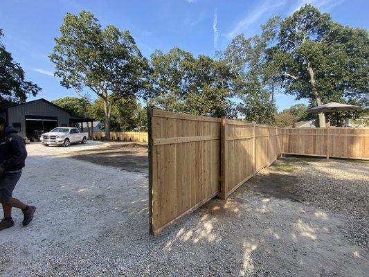 Younger and grove cedar mounted to a cantilever gate frame