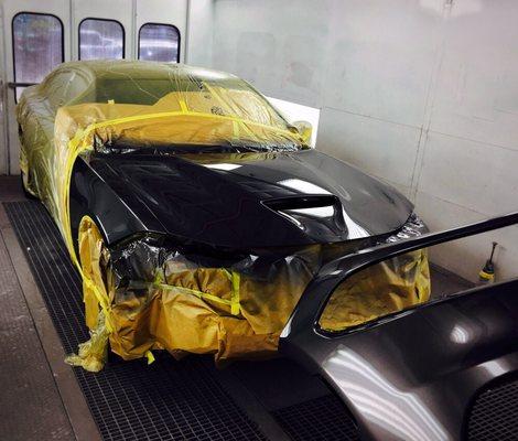 Dodge Charger baking in the paint booth after refinishing work is complete