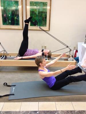 Coreworks instructors demonstrating Pilates at Nordstrom in Columbia