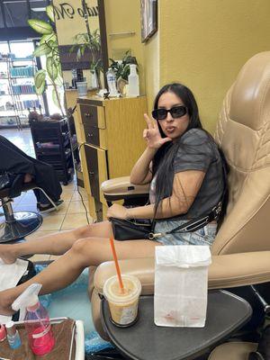 Mariah taking a quick pose while getting her pedi